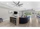 Open living space with ceiling fans and access to the outdoor pool area at 19821 Montenero Way, Venice, FL 34293