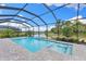 Beautiful screened-in pool and spa overlooking a serene pond and lush greenery at 19821 Montenero Way, Venice, FL 34293