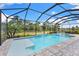 Sparkling screened-in pool with a spa and spacious patio for outdoor relaxation at 19821 Montenero Way, Venice, FL 34293