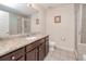 Neutral-toned bathroom features granite counters, tiled floors and walk-in shower at 2001 Bal Harbor Blvd # 2306, Punta Gorda, FL 33950