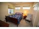 Cozy bedroom with natural light, comfortable furnishings, and a soft chair at 2001 Bal Harbor Blvd # 2306, Punta Gorda, FL 33950