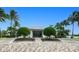 Charming clubhouse entrance with manicured landscaping and symmetrical design at 2001 Bal Harbor Blvd # 2306, Punta Gorda, FL 33950