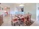 Dining room with hardwood dining table and view of kitchen and entryway at 2001 Bal Harbor Blvd # 2306, Punta Gorda, FL 33950
