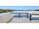 Picturesque view from the wooden dock with seating, perfect for enjoying the serene waterfront at 2001 Bal Harbor Blvd # 2306, Punta Gorda, FL 33950