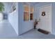 Building entryway with a white door and an arrangement on the floor at 2001 Bal Harbor Blvd # 2306, Punta Gorda, FL 33950