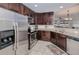Kitchen with stainless steel appliances, dark cabinets, and granite countertops at 2001 Bal Harbor Blvd # 2306, Punta Gorda, FL 33950