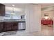 Kitchen bar with stainless steel dishwasher and decorative backsplash at 2001 Bal Harbor Blvd # 2306, Punta Gorda, FL 33950