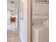 Hallway featuring laundry, utility closet, and views to additional rooms at 2001 Bal Harbor Blvd # 2306, Punta Gorda, FL 33950