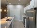 Stylish kitchen with a large island, stainless steel appliances, and ample cabinet space at 207 Baytree Dr, Rotonda West, FL 33947