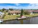 This waterfront home features a private dock with a boat lift and easy canal access at 219 Tait Se Ter, Port Charlotte, FL 33952