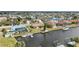 Waterfront home featuring a private dock, boat lift, and quick access to canals at 219 Tait Se Ter, Port Charlotte, FL 33952