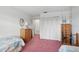 Bedroom includes twin beds, dresser, closet, and access to the en-suite bathroom at 219 Tait Se Ter, Port Charlotte, FL 33952