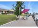 Waterfront home featuring a private dock with an outdoor table and an umbrella at 219 Tait Se Ter, Port Charlotte, FL 33952
