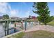 Dock featuring seating with an umbrella and access to the canal at 219 Tait Se Ter, Port Charlotte, FL 33952