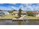 This waterfront home features a private dock with a boat lift at 219 Tait Se Ter, Port Charlotte, FL 33952
