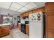Cozy kitchen with wooden cabinetry, black appliances, and bright, sunlight ceiling at 219 Tait Se Ter, Port Charlotte, FL 33952