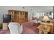 Spacious living room featuring wicker furniture, and a large display cabinet at 219 Tait Se Ter, Port Charlotte, FL 33952