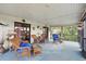 Inviting screened patio with comfortable wicker furniture and views of lush landscaping at 219 Tait Se Ter, Port Charlotte, FL 33952