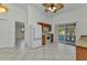 Bright kitchen features tile floors, ample cabinet space, and sliding glass doors to the outdoor patio at 22299 Laramore Ave, Port Charlotte, FL 33952