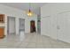 Open-concept living area with tiled floors and neutral paint, perfect for entertaining at 22299 Laramore Ave, Port Charlotte, FL 33952