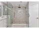 Contemporary bathroom featuring a frameless glass shower with rainfall showerhead and stylish vanity at 229 Waterside St, Port Charlotte, FL 33954