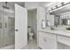 Bright bathroom showcases a modern vanity, updated fixtures, and a frameless glass shower at 229 Waterside St, Port Charlotte, FL 33954