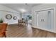 Inviting dining room with wood floors, modern lighting, and a view of the front yard at 229 Waterside St, Port Charlotte, FL 33954