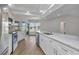 Spacious kitchen with island, stainless steel appliances, and lots of natural light and beautiful views of the outdoors at 229 Waterside St, Port Charlotte, FL 33954