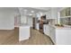 This modern kitchen features an open floor plan, stainless steel appliances, and abundant storage at 229 Waterside St, Port Charlotte, FL 33954