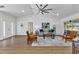 Spacious living room with lots of natural light, wood flooring, and modern decor with neutral paint at 229 Waterside St, Port Charlotte, FL 33954