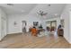 Bright living room with wood floors, stylish furniture, and sliding glass doors to the lanai at 229 Waterside St, Port Charlotte, FL 33954