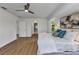 Serene main bedroom featuring wood floors and an ensuite bathroom at 229 Waterside St, Port Charlotte, FL 33954