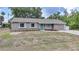 Single-story home featuring well-maintained front landscaping and a paved walkway to the front door at 23165 Glen Ave, Punta Gorda, FL 33980