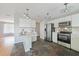 Well-equipped kitchen with stainless steel appliances, white cabinets, and open layout at 23165 Glen Ave, Punta Gorda, FL 33980