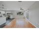 Bright living space with wood flooring, a ceiling fan, and sliding doors leading to the outside at 23165 Glen Ave, Punta Gorda, FL 33980