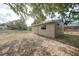 Exterior view of a storage shed with a neutral color and double doors at 23165 Glen Ave, Punta Gorda, FL 33980