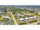 Breathtaking aerial view capturing a well-planned neighborhood with various houses and lush green spaces, offering a sense of community at 232 W Henry St, Punta Gorda, FL 33950