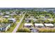 Stunning aerial view of a well-established neighborhood featuring varied housing designs, mature trees, and manicured lawns at 232 W Henry St, Punta Gorda, FL 33950
