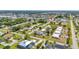 Scenic aerial shot of a peaceful neighborhood with mature trees and diverse home styles, highlighting suburban tranquility at 232 W Henry St, Punta Gorda, FL 33950