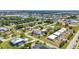 Expansive aerial view of a vibrant residential area featuring well-spaced homes and verdant landscaping at 232 W Henry St, Punta Gorda, FL 33950