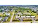 Attractive aerial view showcasing a residential community with a mix of housing styles and mature landscaping, providing a serene atmosphere at 232 W Henry St, Punta Gorda, FL 33950