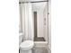 Contemporary bathroom showcasing a shower with decorative tiling, modern fixtures, and a gray rug at 232 W Henry St, Punta Gorda, FL 33950