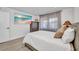 Cozy bedroom featuring modern light fixtures, a wardrobe, and a large screen tv at 232 W Henry St, Punta Gorda, FL 33950