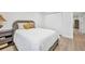 This bright bedroom features light colored flooring, and a nearby closet at 232 W Henry St, Punta Gorda, FL 33950