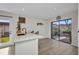 Modern kitchen with a view to a private courtyard, combining indoor and outdoor living at 232 W Henry St, Punta Gorda, FL 33950