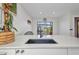Bright kitchen with a modern sink and view of the outdoor patio at 232 W Henry St, Punta Gorda, FL 33950