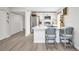 Open kitchen layout with breakfast bar seating, enhancing functionality and style at 232 W Henry St, Punta Gorda, FL 33950