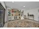Bright living room with a large area rug, custom built-ins, and plenty of natural light throughout the space at 232 W Henry St, Punta Gorda, FL 33950