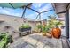 Cozy patio area with potted plants, stone flooring, and partial shade cover, perfect for outdoor relaxation at 232 W Henry St, Punta Gorda, FL 33950