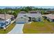Aerial view of the house with a front lawn at 2399 Bendway Dr, Port Charlotte, FL 33948